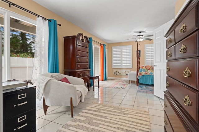 interior space featuring ceiling fan and light tile patterned floors