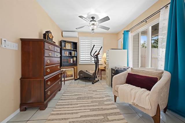 sitting room featuring an AC wall unit, ceiling fan, and light tile patterned floors