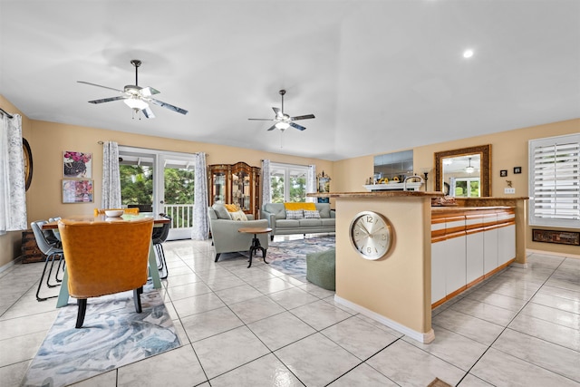 interior space featuring white cabinetry, ceiling fan, and light tile patterned floors