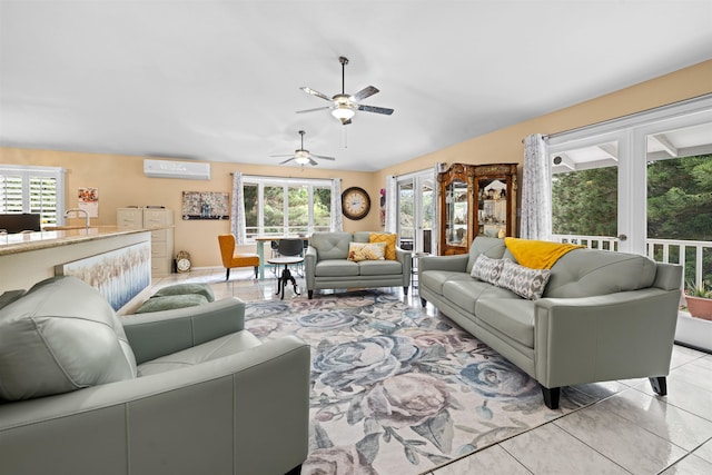 living room featuring french doors, a wall unit AC, light tile patterned floors, and a healthy amount of sunlight