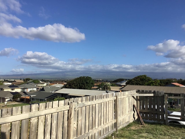 exterior space with a residential view and fence