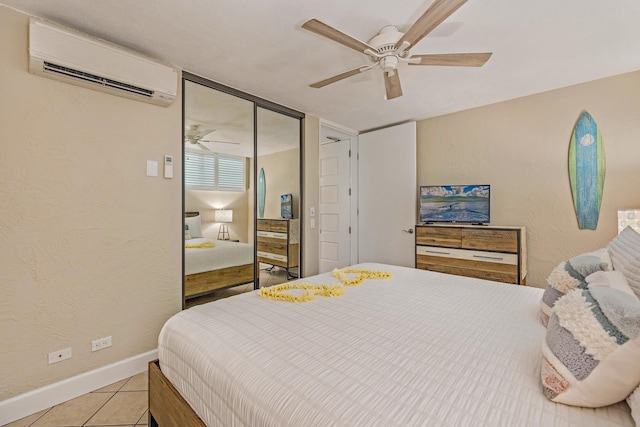 bedroom featuring a closet, a wall mounted AC, ceiling fan, and light tile patterned floors