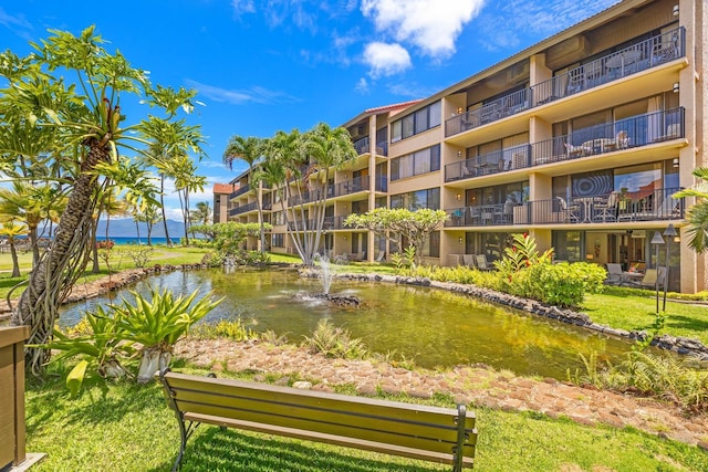 view of home's community with a water view