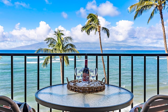 balcony with a water and mountain view