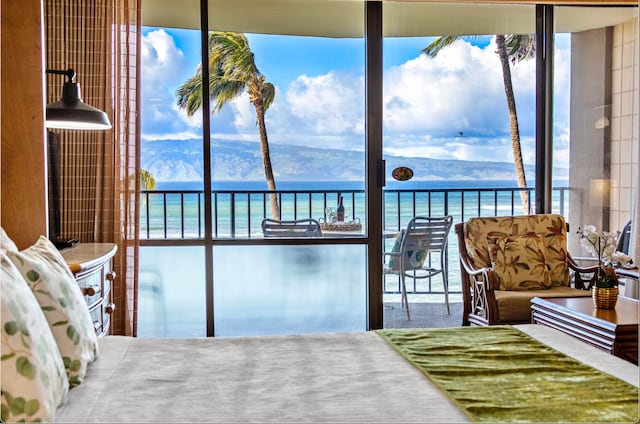 bedroom with a water and mountain view