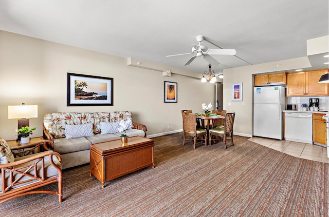 living room featuring light tile patterned floors and ceiling fan