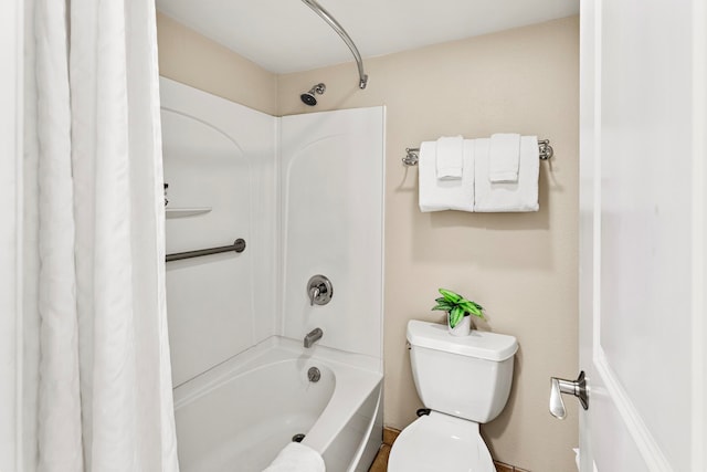 bathroom featuring shower / tub combo with curtain and toilet