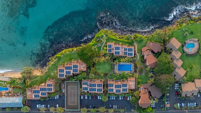 birds eye view of property with a water view