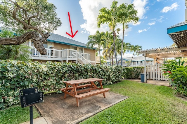 view of yard featuring a pergola, a patio, and a deck