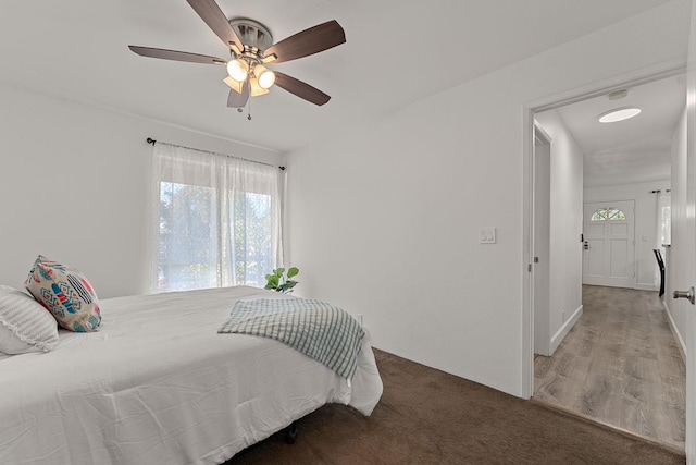 bedroom featuring wood-type flooring and ceiling fan