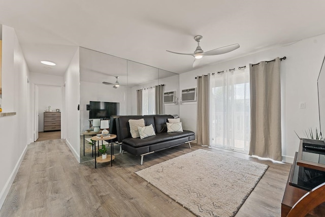 living room with wood-type flooring and ceiling fan