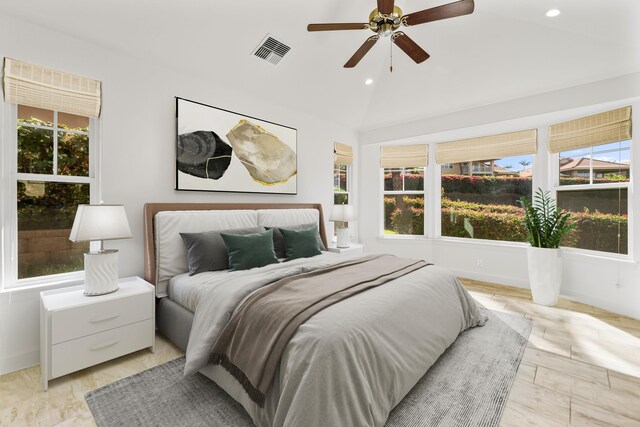 bedroom with ceiling fan and vaulted ceiling