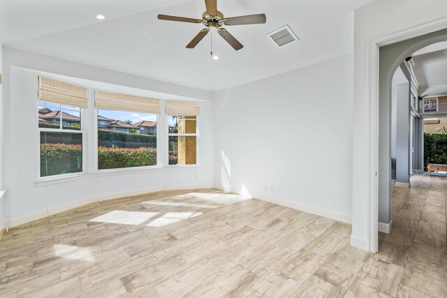 unfurnished room featuring ceiling fan and light hardwood / wood-style floors