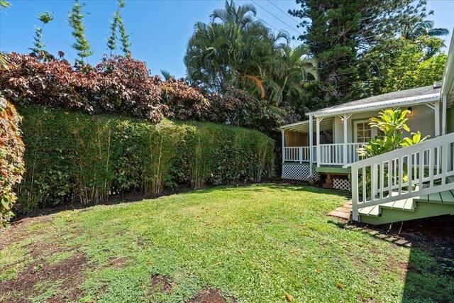 3217 Luahine Pl, Haiku, HI 96708 - view of grassy yard featuring a porch