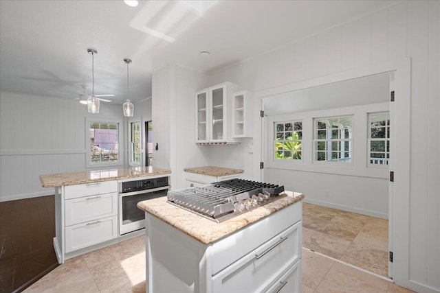 3217 Luahine Pl, Haiku, HI 96708 - kitchen with stainless steel appliances, a kitchen island, and plenty of natural light