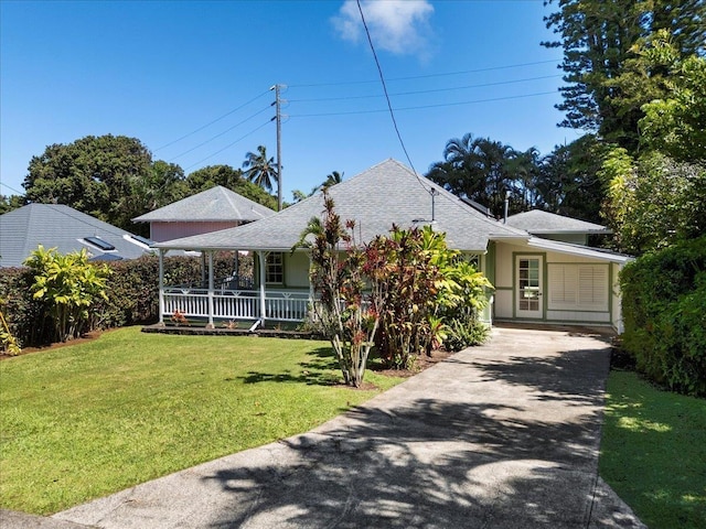 3217 Luahine Pl, Haiku, HI 96708 - view of front of house featuring driveway, a porch, a front yard, and a shingled roof
