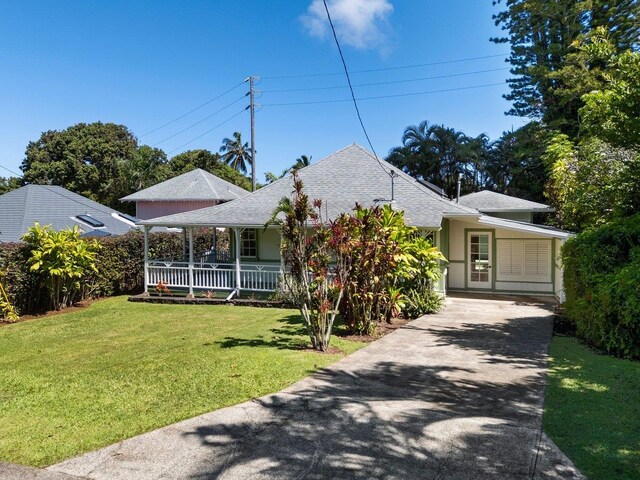 3217 Luahine Pl, Haiku, HI 96708 - view of front of property with asphalt driveway, a front yard, a porch, and a shingled roof