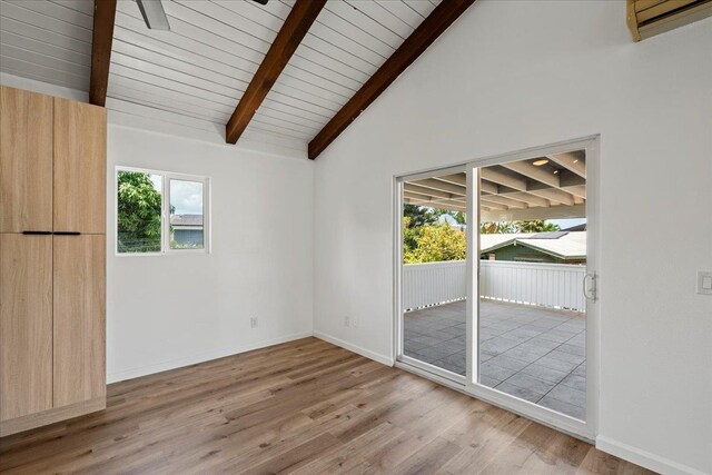 402 Auhana Rd, Kihei, HI 96753 - spare room featuring wood finished floors, an AC wall unit, and wooden ceiling