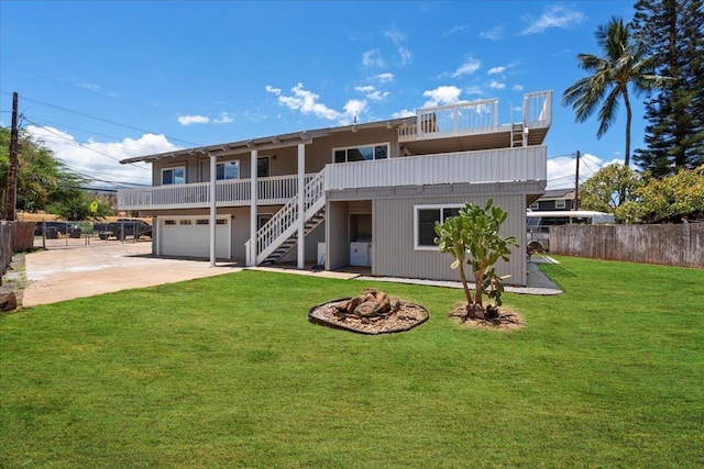 402 Auhana Rd, Kihei, HI 96753 - rear view of property featuring stairs, an attached garage, driveway, and an outdoor fire pit