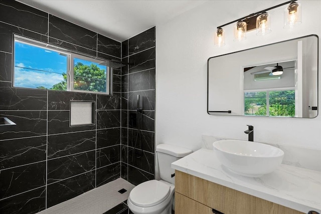 402 Auhana Rd, Kihei, HI 96753 - full bath with vanity, a tile shower, and plenty of natural light