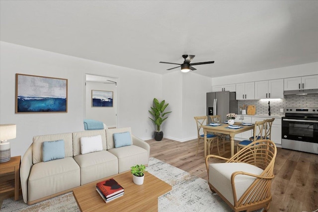 402 Auhana Rd, Kihei, HI 96753 - living area with ceiling fan and wood finished floors