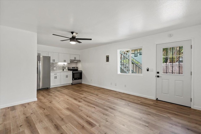 402 Auhana Rd, Kihei, HI 96753 - unfurnished living room featuring ceiling fan and light wood finished floors