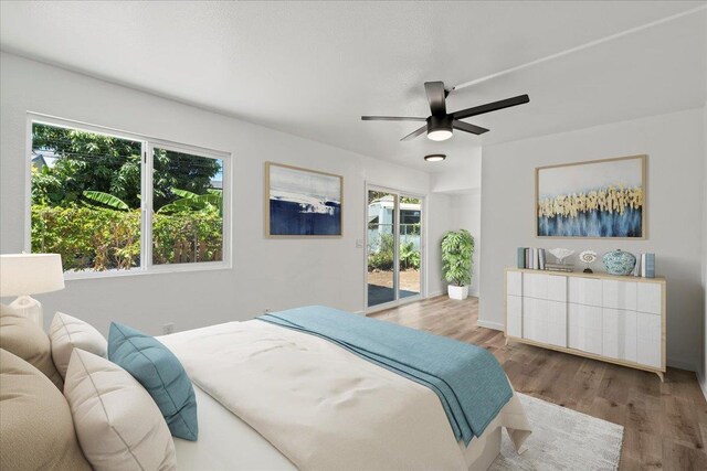 402 Auhana Rd, Kihei, HI 96753 - bedroom with access to exterior, wood finished floors, and a ceiling fan