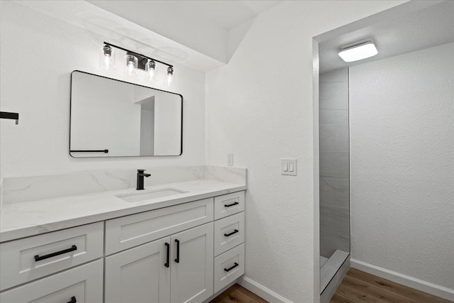 402 Auhana Rd, Kihei, HI 96753 - full bath featuring wood finished floors, vanity, and a tile shower