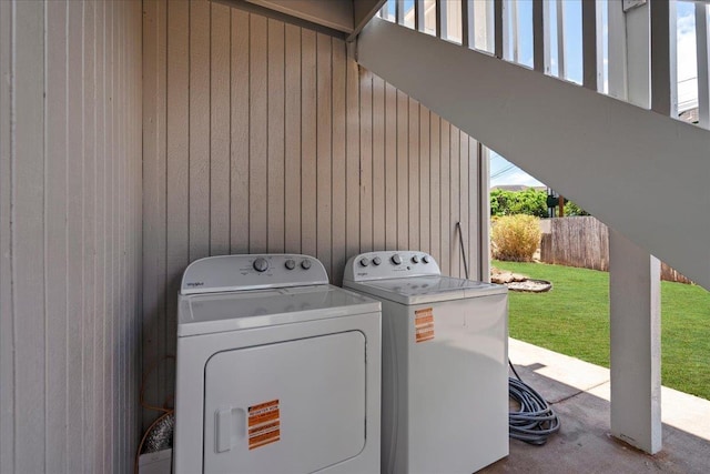 402 Auhana Rd, Kihei, HI 96753 - laundry area with carpet floors, washing machine and clothes dryer, and wooden walls