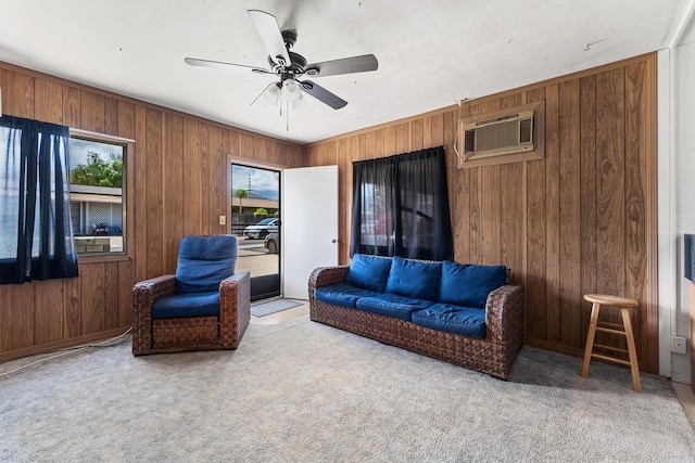 119 Kupalaiki Loop, Kihei, HI 96753 - living room with an AC wall unit, wooden walls, carpet, and a ceiling fan