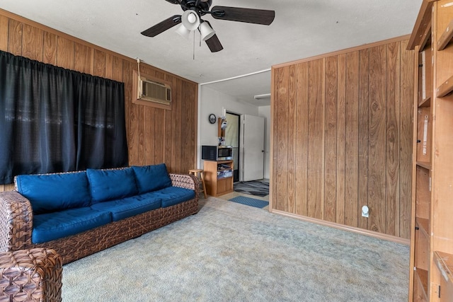 119 Kupalaiki Loop, Kihei, HI 96753 - living room with wood walls, ceiling fan, a wall mounted AC, and carpet
