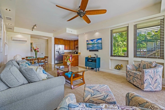 carpeted living room featuring ceiling fan and a wall mounted air conditioner