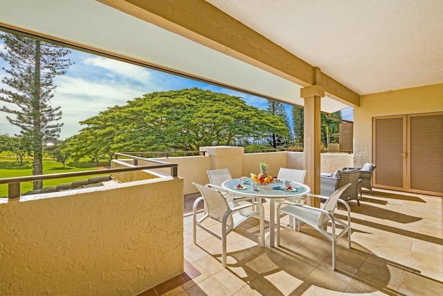 view of patio featuring a balcony