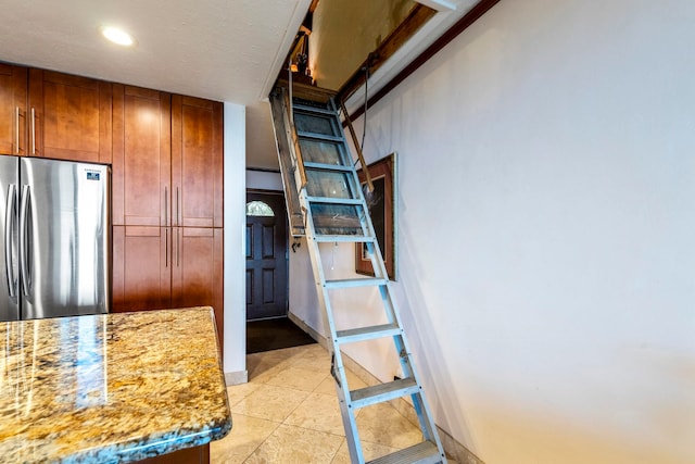 2075 S Kihei Rd Unit 214, Kihei, HI 96753 - kitchen featuring freestanding refrigerator, light stone countertops, brown cabinetry, recessed lighting, and light tile patterned floors