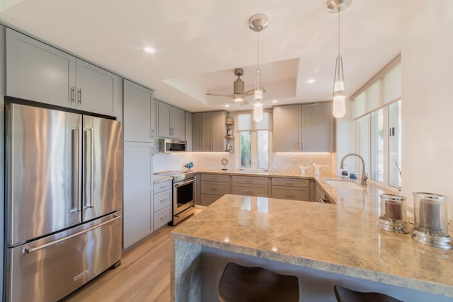 3200 Wailea Alanui Dr Unit 1606, Kihei, HI 96753 - kitchen featuring stainless steel appliances, a tray ceiling, open shelves, healthy amount of natural light, and recessed lighting