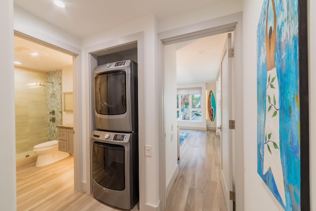 3200 Wailea Alanui Dr Unit 1606, Kihei, HI 96753 - washroom with stacked washer / dryer and light wood-style floors