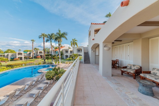 3200 Wailea Alanui Dr Unit 1606, Kihei, HI 96753 - view of pool with a residential view, a pool with connected hot tub, a patio, and stairs