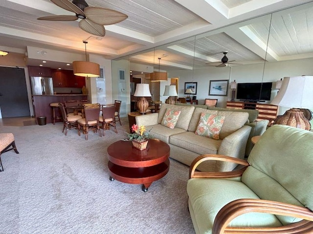 carpeted living room featuring beamed ceiling, ceiling fan, and coffered ceiling