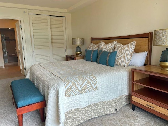 bedroom with carpet flooring and a closet