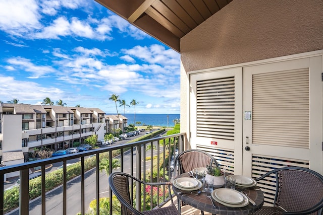 balcony featuring a water view