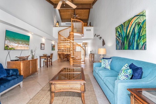 tiled living room featuring ceiling fan, wood ceiling, and high vaulted ceiling