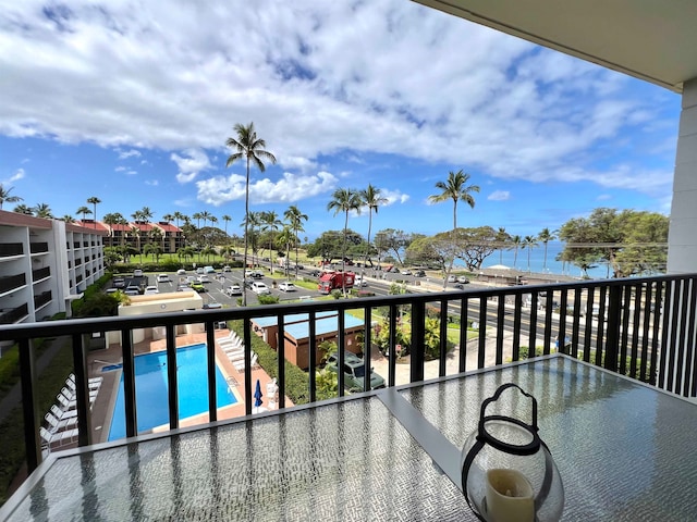 balcony featuring a community pool