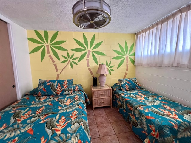 tiled bedroom with a textured ceiling