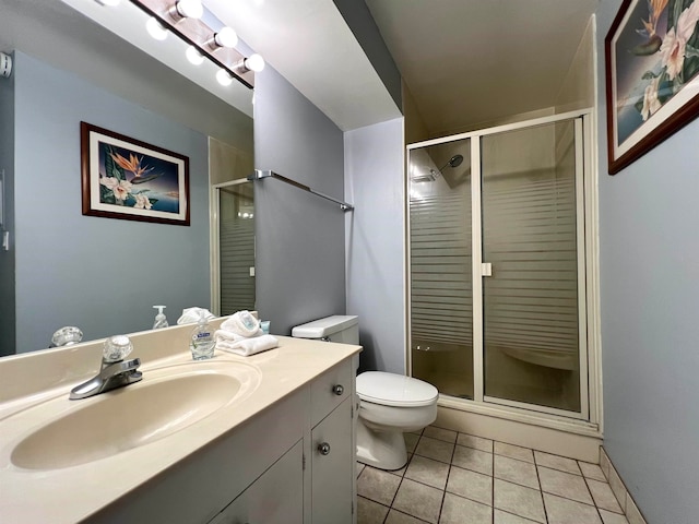 bathroom featuring walk in shower, toilet, tile flooring, and vanity