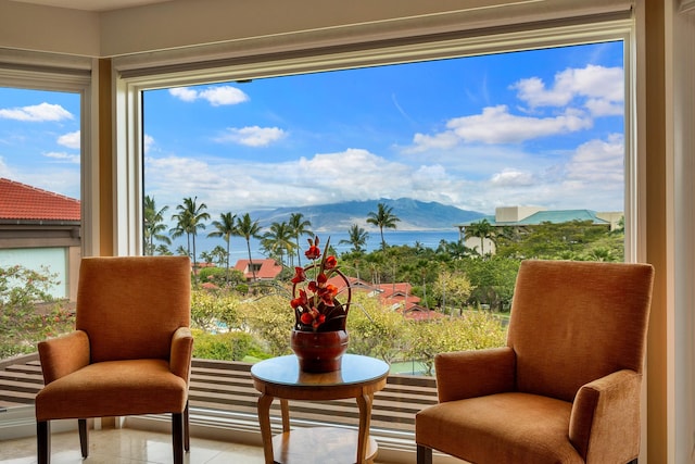 living area featuring a water view