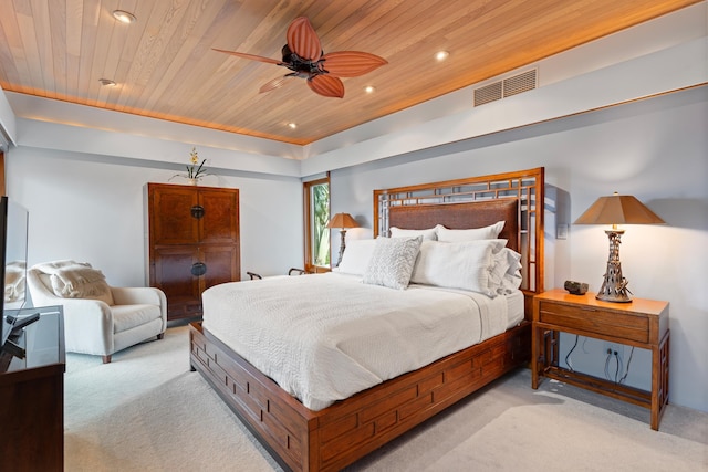 bedroom with wood ceiling, light colored carpet, and ceiling fan