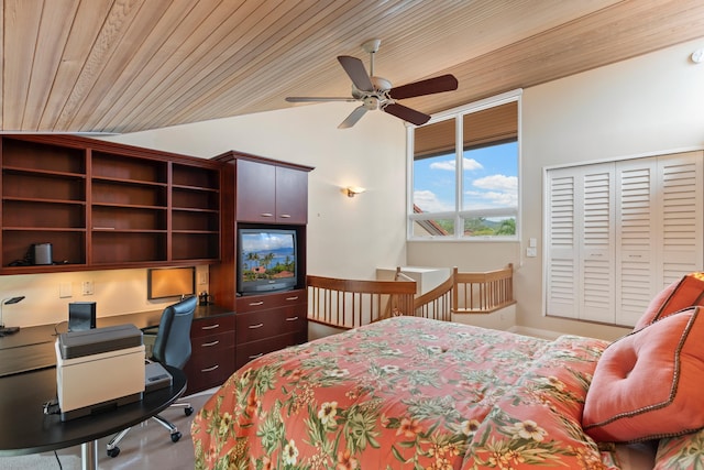 bedroom with wood ceiling, lofted ceiling, ceiling fan, and a closet