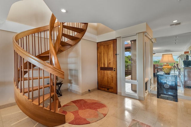 foyer featuring light tile floors