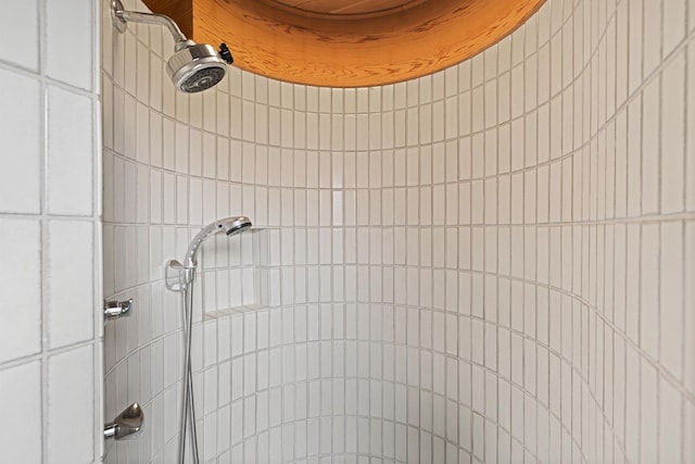 bathroom with a tile shower