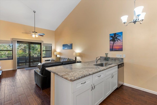 kitchen with light stone counters, sink, white cabinets, high vaulted ceiling, and dark hardwood / wood-style flooring